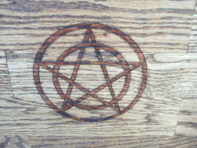 Pentacle representing protection on front door.