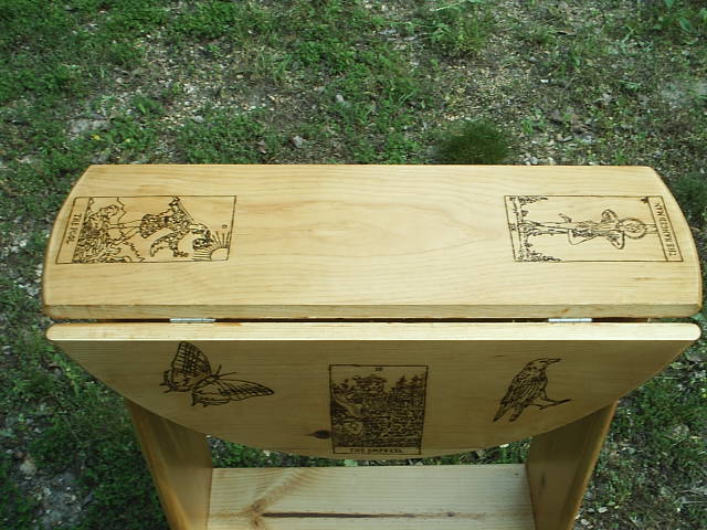 Folding sides on the custom design tarot table for easy transport