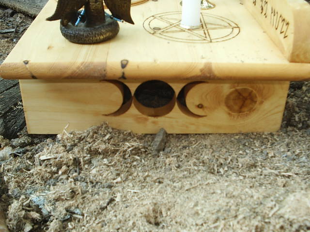 Goddess Symbol Scrolled Into The Right Leg of this Wiccan Altar